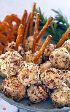 a platter filled with pretzels and carrot sticks