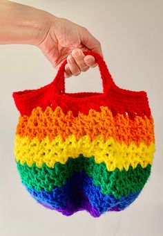 "A rainbow crocheted market bag custom made just for you! Bag measures approximately 11.5\" wide and 10.5\" tall.  Perfect for a small grocery run or for your little one to use for their play veggies and fruits.  Great to use as a storage bag for your little ones sorting toys, too.  Pattern credit: www.facebook.com/islandstylecrochet www.ravelry.com/designers/divina-rocco" Multicolor Crochet Tote Bag For Festival, Multicolor Top Handle Crochet Shopping Bag, Rainbow Granny Square Bag, Rainbow Montessori, Crocheted Market Bag, Crochet Rainbow Purse, Eco-friendly Multicolor Crochet Bags, Veggies And Fruits, Purse Storage