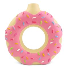 a pink doughnut with sprinkles is on a white surface and has a yellow ring around it