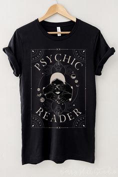 Psychic Lover, Psychic Reader Graphic Tee in Black  Feels soft and lightweight, with the right amount of stretch, and It's comfortable and flattering. All inks used to print are high quality, water-based and eco-friendly. This T-shirt is unisex sizing - it is larger than your typical woman's t-shirts. Please use the sizing guide for best fit - you can use your own T-shirt to compare measurements: see the sizing chart provided in product photos. Fabrication Solid Colours - 100% Airlume combed and Tarot Shirt Design, Spiritual Shirt Ideas, Witchy Shirt Design, Witch Tshirt Ideas, Witchy Tshirt, Motivational Shirts, Clothes Print, Goth Christmas, Witchy Aesthetic