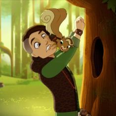 a man holding a squirrel on his shoulder in front of a tree with an animal hanging from it's back