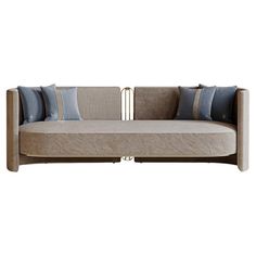 a couch that is sitting on top of a white surface with blue and gray pillows