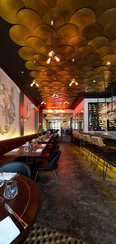 an empty restaurant with many tables and chairs