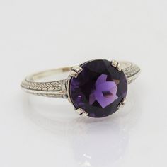 Vintage Sterling Silver Round cut Amethyst Ring...Marked 925...Total of weights 2.5grams... Size 9...Measure of stone 10MM...It's in very good condition. Classic Purple Sterling Silver Ring, Classic Purple Gemstone Birthstone Ring, Classic Purple Birthstone Ring With Gemstone, Classic Amethyst Purple Rings, Classic Sterling Silver Amethyst Ring With Center Stone, Classic Purple Amethyst Ring Round Cut, Classic Purple Amethyst Round Cut Ring, Classic Purple Amethyst Ring With Round Cut, Classic Purple Sapphire Ring In Sterling Silver