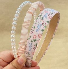 Step into the elegance of the Regency era with our charming Bridgerton 3pc Hairband! This delightful accessory features delicate ribbons, capturing the romantic essence of a Bridgerton garden party. Perfect for adding a touch of vintage charm to your summer wardrobe, this hairband is both cute and summery, making it ideal for tea parties, garden gatherings, or a leisurely stroll in the park. The comfortable, lightweight design ensures it stays in place while keeping you cool and stylish. Embrace Bridgerton Tea Party, Simple Fabric, Style Headband, Ruffles Fashion, Estilo Boho, Hair Accessories Headbands, Vintage Charms, Garden Party, Faux Pearl