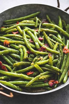 cooked green beans with bacon in a pan