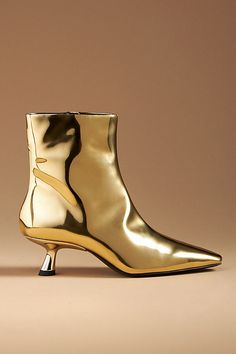 Can we talk a boot this style? SIMONMILLER's Kuki Ankle Boots feature a pointed toe and kitten heel in chrome leather. | Kuki Chrome Kitten-Heel Ankle Boots by SIMONMILLER in Gold, Women's, Size: 40, Leather/Rubber at Anthropologie Metallic Boots For Formal Fall Occasions, Elegant Gold Boots With Metal Feet, Chic Metallic Heeled Boots For Fall, Chic Gold Snip Toe Boots, Chic Gold Heeled Boots With Pointed Toe, Metallic Pointed Toe Boots For Fall, Metallic Ankle Boots For Formal Occasions, Fall Metallic Pointed Toe Heeled Boots, Fall Metallic Heeled Boots With Pointed Toe