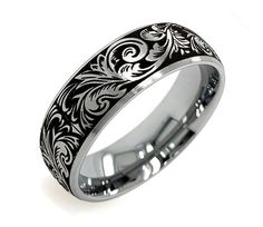 a wedding ring with an intricate design on it