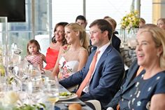 a group of people sitting at a dinner table