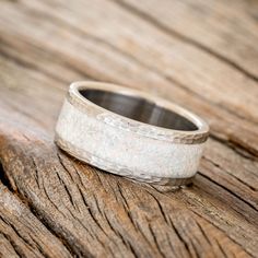 a wedding band that is on top of a wooden table