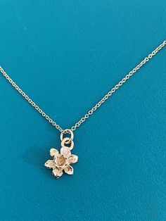 This tiny little daffodil necklace is made from solid 9 carat gold and is cast from one I have had since I was a child.  I love this little daffodil, its so dainty and delicate and really realistic.  It’s a beautiful piece of jewellery to wear, and is excellently made here in my Devon studio.The daffodil comes on an 18 inch chain and looks great as part of a layered set or on its own.  Really beautiful floral vintage feel. Daffodil Necklace, Green Grey Paint, Sell Gold, Floral Vintage, Unique Necklaces, Flower Necklace, Wedding Anniversary Gifts, Daffodils, Devon