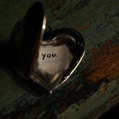 a heart shaped object with the word you written on it