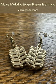 pair of gold-edge ivory quilled earrings with ear wire hooks. Earrings To Make, Quilled Earrings, Earring Designs, Quilling Patterns