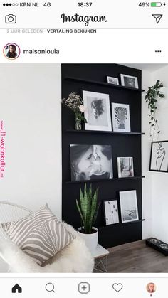 the instagram page on instagram shows an image of a living room with pictures and plants