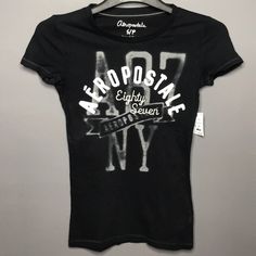 Black Graphic Tee 100% Cotton Aeropostale Graphic Tees Women, Black Graphic Tee, Black Graphic Tees, Tops Black, Black Shorts, Aeropostale, Graphic Tee, Fashion Inspo, Graphic Tees