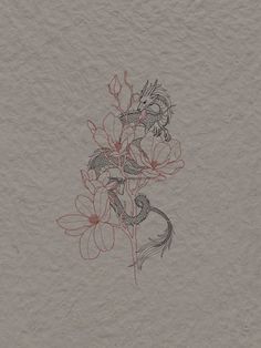 a drawing of flowers on a piece of paper with red ink in the middle, and a bird sitting on top of it