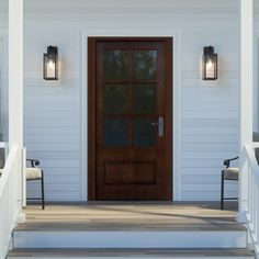 the front door to a white house with two chairs on the porch next to it