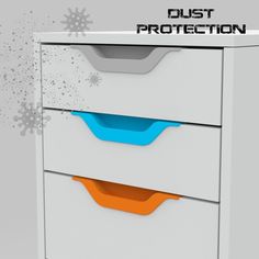 a white and orange drawer with dust on the bottom, in front of snowflakes