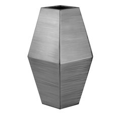 a large metal vase sitting on top of a white surface with no one in it