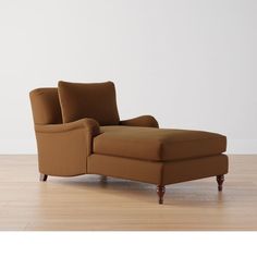 a chair sitting on top of a hard wood floor next to a white wall in an empty room