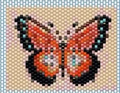 a close up of a cross stitch butterfly