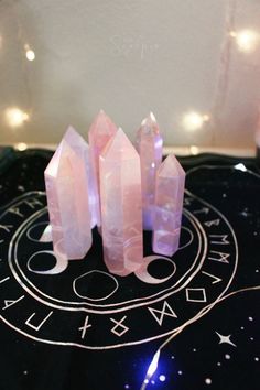 three pink crystals sitting on top of a table