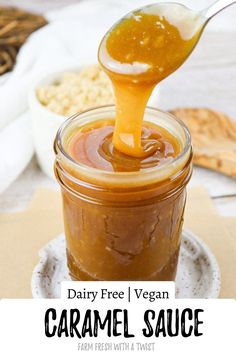 a spoon full of caramel sauce on top of a plate