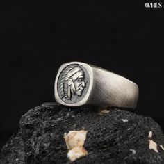 🎁 Looking for a unique and meaningful gift that will leave a lasting impression? 🪶 Discover our Men's Native American Signet Ring, a remarkable piece of silver jewelry that honors the rich heritage and culture of Native American tribes. This stunning tribal ring features an intricately detailed depiction of a Native American chief, a powerful symbol of strength, wisdom, and respect for tradition.  𝐑𝐈𝐍𝐆 𝐅𝐄𝐀𝐓𝐔𝐑𝐄𝐒 * 𝑺𝒕𝒆𝒓𝒍𝒊𝒏𝒈 𝑺𝒊𝒍𝒗𝒆𝒓: Crafted from high-quality 925 sterling Adjustable Symbolic Carved Rings, Signet Ring Silver, Native American Chief, American Gifts, American Indian Jewelry, Stand By You, Native American Tribes, Gift For Husband, Jewelry Ring