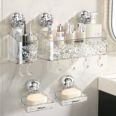 two clear shelfs with soap and lotion on them