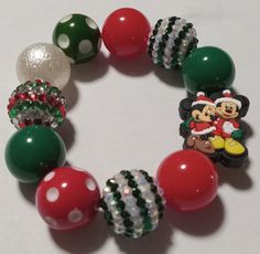 Elastic bracelet with a Christmas color themed. All bracelets are adult size unless otherwise specified. Cute Adjustable Christmas Jewelry, Green Christmas Festive Bracelets, Adjustable Green Bracelets For Holiday, Adjustable Festive Bracelets For Christmas, Adjustable Christmas Bracelets For Festive Occasions, Themed Green Beaded Bracelets For Gifts, Adjustable Christmas Bracelets, Adjustable Green Christmas Bracelets, Themed Green Beaded Bracelets As Gift