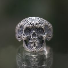 Skull 925 Sterling Silver Ring, Handmade Skull Ring, Silver Skull Men Ring, Biker Silver Ring, Big Men Ring, Memento Mori Engraving Ring --->Materials:   - 925 Silver --->The ring size on the model is 9 US. --->Items are shown larger in pictures to show detail - please note the dimensions. This item is in my shop are handcrafted made to order. --->Accessories: - beautiful jewelry boxes, and some of little gifts. --->Guaranteed Purchase: - 14 Day Refund Guarantee; - Excellent Customer Service; - Free Transportation and insurance to All Parts Of The World; - Free Gift Box&Packing --->Please contact us if you need service: - Ring Resizing; - Metal Change(10k/14k/18k White/Yellow/Rose Gold) - Engraving(shoule be less than 10 letter ) - Customize the unique ring of your idea Visit my shop to vi Symbolic Skull Rings Collectible, Symbolic Engraved Skull Ring, Collectible Symbolic Skull Rings, Collectible Engraved Skull-shaped Rings, Collectible Symbolic Skull Ring Stamped 925, Engraving Ring, Handmade Skulls, Gold Engraving, Men Ring