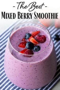 berry smoothie in a glass with strawberries and blueberries