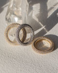 A pave ring version of our best-selling Baby Amalfi Hoops Ring is 4.3 mm tall Made from plated brass and Cubic Zirconia stones Plating is 0.03 microns + e-coating for long lasting durability Plated high polish 14K Antique Gold for maximum shine Hand set CZ stones for a luxe fine-jewelry look Available is US Sizes 5, 6, and 7 | Click here for your international ring size conversion Ring is 100% nickel-free and cadmium-free Available in Silver too Also available in an all metal version As seen on Jewellery Photography Inspiration, Luv Aj, Pave Ring, Cubic Zirconia Rings, Jewelry Photography, Ceramic Jewelry, Cz Stone, Gold Bangles, Amalfi