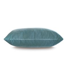 a blue pillow on a white background