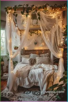 a bed with white curtains and lights on it