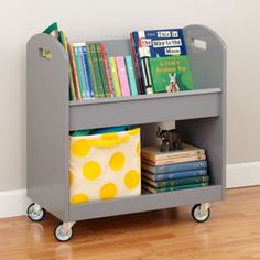 a gray book cart with books on it