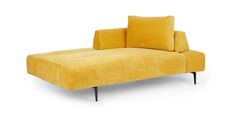 a yellow couch sitting on top of a white floor