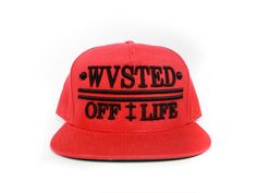 "Features Plastic adjustable closure Green undervisor Hard buckram backed front panels 3¾\" crown Eight-row stitching on flat visor 5-panel, structured, high-profile 100% cotton Make a bold statement with our 'Wasted Off Life' snapback hat. This high-quality hat features a vibrant red color and the phrase 'Wasted Off Life' embroidered across the front in a contrasting black thread. The adjustable snapback closure ensures a perfect fit for any head size, while the curved brim provides added shade and style. Whether you're hitting the town or just hanging out with friends, this hat is sure to turn heads and make a statement. Embrace the carefree attitude of 'Wasted Off Life' with this trendy snapback hat." Quality Hats, Black Thread, Snapback Hat, Vibrant Red, Trucker Cap, Snapback Hats, Red Color, Caps Hats, Accessories Hats