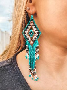 Beaded Turquoise Earrings Additional Information: Materials: Glass & Iron Absolutely stunning large beaded earrings that give an extra layer to your style. Fish hook back. Beaded Turquoise Earrings, Earring Inspired, Native Crafts, Earrings Ideas, Beaded Earring, Nativity Crafts