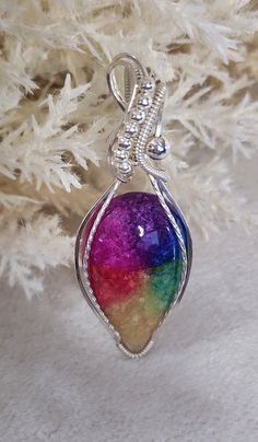 Beautiful and Unique 36 mm x 23 mm teardrop shaped rainbow Solar Quartz cabochon wrapped in sterling silver wire and beads. Beads And Wire, Quartz Pendant, Wire Wrapped Jewelry, Silver Wire, X 23, Wire Wrapped, Pendant Necklaces, Wire Wrapping, Jewelry Necklace Pendant