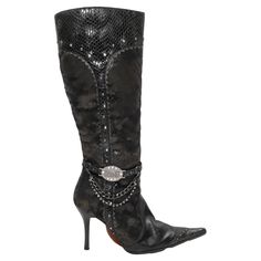 Black leather and snakeskin pointed-toe knee-high boots by 1 to 3. Silver-tone hardware embellishments throughout. Zip closure at inner sides. 13.5" shaft height, 4" heel height. Western Style Leather Knee-high Boots For Party, Western Style Leather Evening Boots, Fur Loafers, French Shoes, Manolo Blahnik Black, Trendy Shoes Sneakers, European Shoes, Evening Sandals, Embellished Sandals