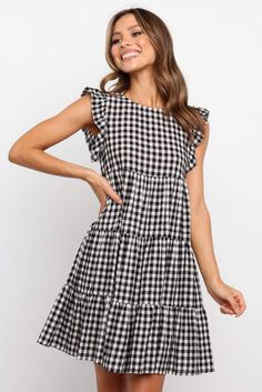 Tiered swing dress with ruffle sleeves in a classic plaid Light and comfy material 100% polyester Relaxed fit Size reference: S (US 4-6) M (US 8-10) L (US 12-14) Short Black Gingham Dress, Ruffled Mini Dress, Sunday Dress, Flowy Mini Dress, Ruffle Sleeve Dress, Ruffle Mini Dress, Office Business, Dresses By Length, Flutter Sleeve Dress