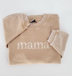 Mama Floral Embroidered Corded  Sweatshirt, Mother's Day Gift,, Mommy Crewneck For Mother's Day, Pregnancy Announcement, Family Gift. These Floral Mama Embroidered Sweatshirt it's a perfect gift! Our bestseller corded oversized sweatshirt is made of the ultra-cozy corded fabric.  Features an oversized fit, ribbed crew neckline, cuffs, and hemline.  Each piece is individually dyed and finished with a vintage wash so there may be variation in color piece to piece. Sometimes, there can be a light s Custom Embroidered Relaxed Fit Tops For Loungewear, Custom Embroidery Loungewear Tops, Relaxed Fit Tops With Custom Embroidery For Loungewear, Embroidered Cream Cotton Sweater, Cream Embroidered Cotton Sweater, Cream Cotton Embroidered Sweater, Winter Loungewear Tops With Embroidered Graphics, Long Sleeve Top With Embroidered Text For Loungewear, Long Sleeve Cotton Tops With Machine Embroidery