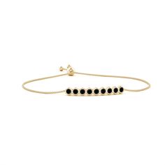 This elegant 14k yellow gold Natori bracelet features round black onyxes, arranged in a linear fashion. These black onyxes are secured in bezel settings within hexagonal frames. It is adjustable to fit most wrists. Elegant Black Chain Bracelet With Adjustable Chain, Elegant Black 14k Gold Bracelets, Elegant Black Adjustable Gold Bracelet, Elegant Black Bracelets In 14k Gold, Elegant Black Adjustable Chain Bracelet, Elegant Black Bracelet With Adjustable Chain, Black Adjustable Elegant Gold Bracelet, Elegant Adjustable Black Gold Bracelet, Timeless Black Jewelry With Bezel Setting