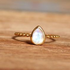 Rainbow moonstone ring, Gold plated Sterling silver, 0.5 micron nickel free plating, stackable ring, minimalist ring, midi ring, statement ring, cocktail ringDescription:I make the gemstones myself for my valued customers so I assure you that the gemstones are NATURAL and are made from ETHICALLY SOURCED ROUGHSThe rest of the ring is made from 925 STERLING SILVER i.e 92.5% pure silver. And it DOESN'T HAVE ANY LEAD OR NICKEL.0.5 MICRONE GOLD PLATING has been done. With time, it will wither like an Moonstone Stackable Jewelry, Spiritual Stackable Moonstone Jewelry, Adjustable Stackable Moonstone Jewelry, Minimalist Gold Moonstone Ring, Minimalist Gold Moonstone Crystal Ring, Gold Minimalist Crystal Ring With Moonstone, Dainty Stackable Moonstone Jewelry, Stackable Moonstone Jewelry Gift, Minimalist Handmade Moonstone Crystal Ring