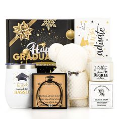 a graduation gift hamper filled with gifts and congratulations cards, including a teddy bear