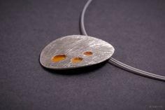 Brushed silver Necklace with orange enamel. This oval shape necklace is made of fine sterling silver 925 and torch enameled. The pendant measures 2cm in width and 2.6 cm in height. The chain is stainless steel wire covered with plastic and measures 42 cm in length. MATCHING EARRINGS: https://www.etsy.com/listing/963650939/orange-stud-earrings-brushed-silver-925?ref=shop_home_active_2&frs=1 MATCHING RING: https://www.etsy.com/listing/969319723/orange-enamel-silver-ring-statement-ring?ref=shop Modern Orange Sterling Silver Jewelry, Modern Orange Oval Jewelry, Modern Orange Necklace As Gift, Modern Orange Necklace For Gift, Unique Orange Sterling Silver Necklace, Sterling Silver Pendant Necklace In Orange, Orange Oval Sterling Silver Necklace, Oval Orange Sterling Silver Necklace, Modern Silver Enamel Necklace