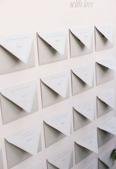 there are many folded cards on the wall