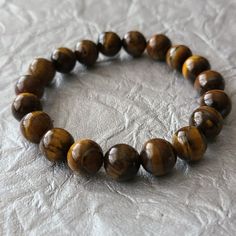 Tiger Eye Stone Beaded Bracelet-Gemstone Bracelet-Healing Stone Material: Tiger Eye Stone Dimension: 6.5 In Length New Without Tag Stone Material, Bracelet Gemstone, Gemstone Beaded Bracelets, Tiger Eye Stone, Eye Stone, Healing Stone, Gemstone Bracelet, Healing Stones, Tiger Eye