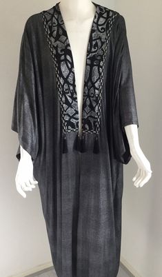 I hand painted the pattern of this silver black abaya after the Arabic motif was lasered. The hand painting was completed after almost 2 months. This unique abaya is one size or free size. Handwash -------------------------- Your Stylist for your personal fashion You want to buy an exclusive and unique shawl.  Or you want a dress for a special occasion. You want to have it designed exclusively for you, perfectly fitting your character. Also the accessoires perfectly fit. You feel a colorful uniq Bohemian Black Evening Abaya, Elegant Black Summer Abaya, Elegant Maxi Length Kimono For Festivals, Elegant Maxi Length Festival Kimono, Bohemian Style Abaya For Evening Eid Festival, Bohemian Evening Abaya For Eid, Bohemian Evening Long Abaya, Evening Bohemian Long Abaya, Bohemian Tunic Abaya For Party